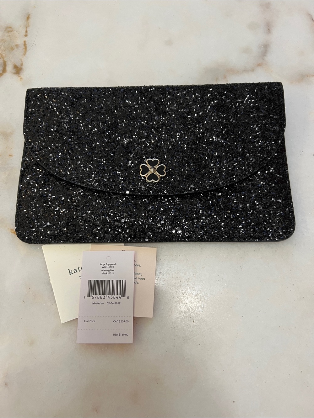 kate spade Black Glitter Envelope Wristlet with Spade Flower Emblem